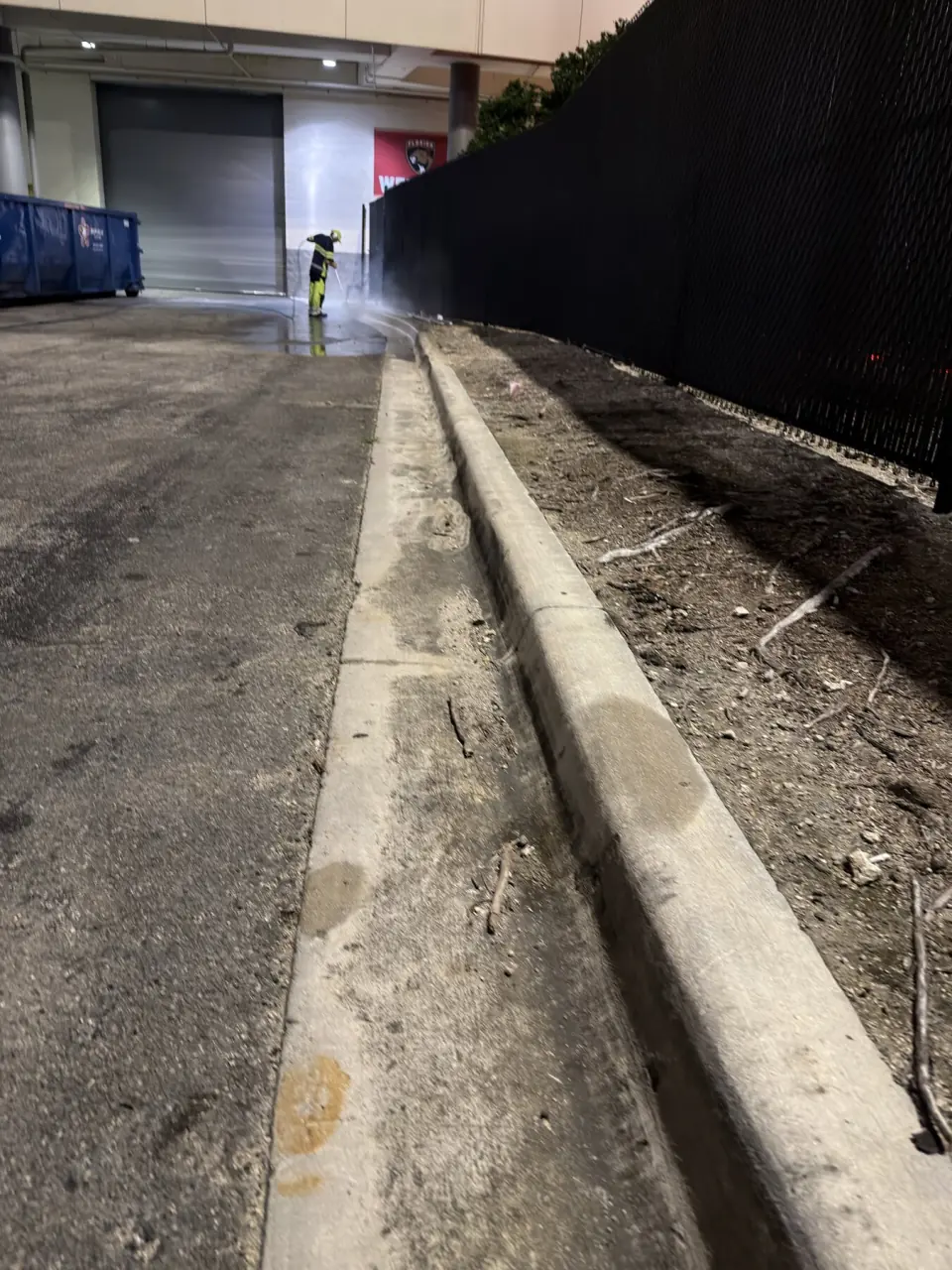 Parking garage curb and gutter before pressure cleaning