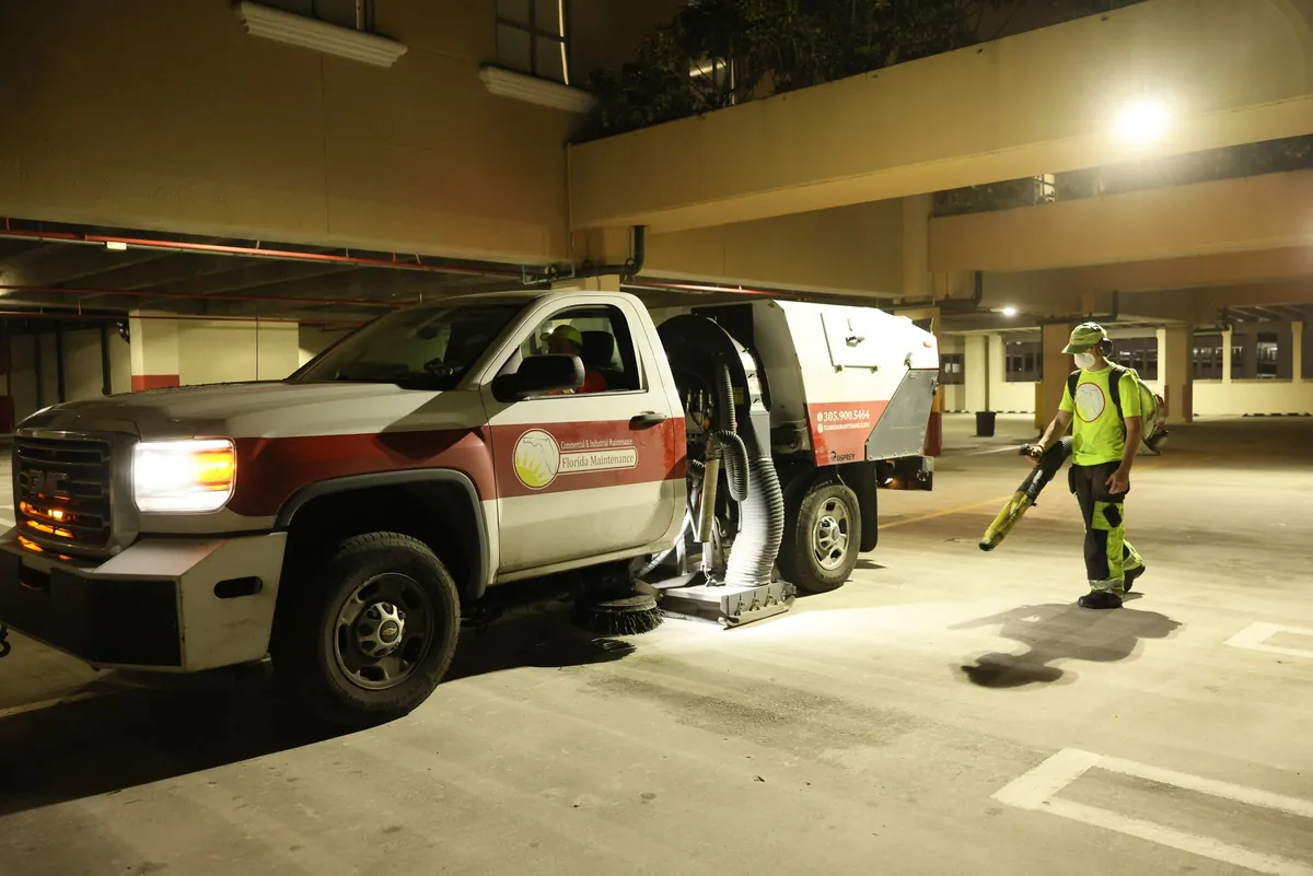 Florida Maintenance crew sweeping a parking garage