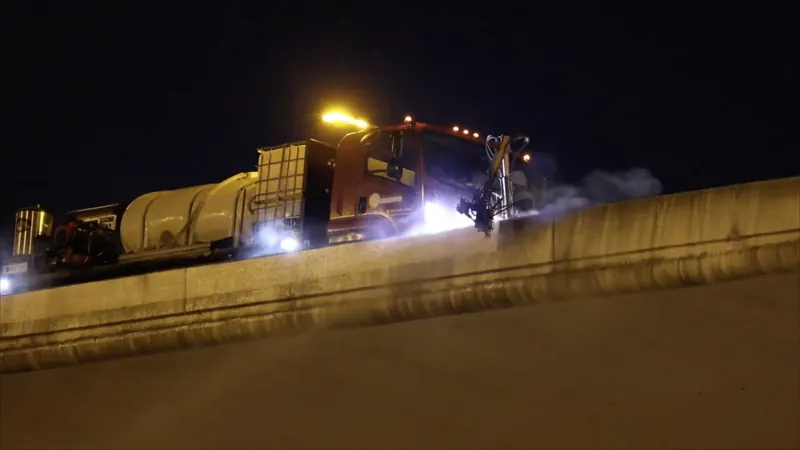 Night highway wall cleaning